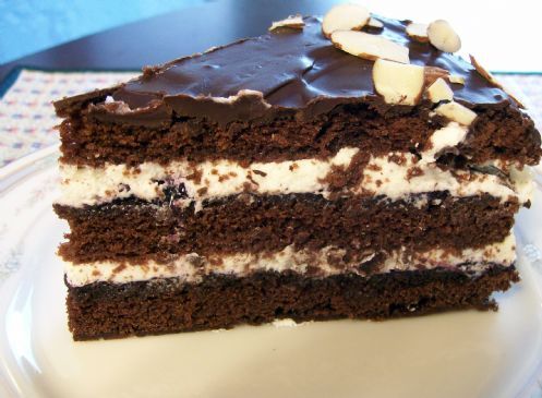 Choclate fudge cake with blueberry jam and whipped cream