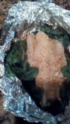 Gingered cod over wilted greens
